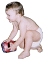 boy toddler in diaper with a toy